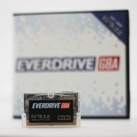 EverDrive GBA cart in front of a blurry box